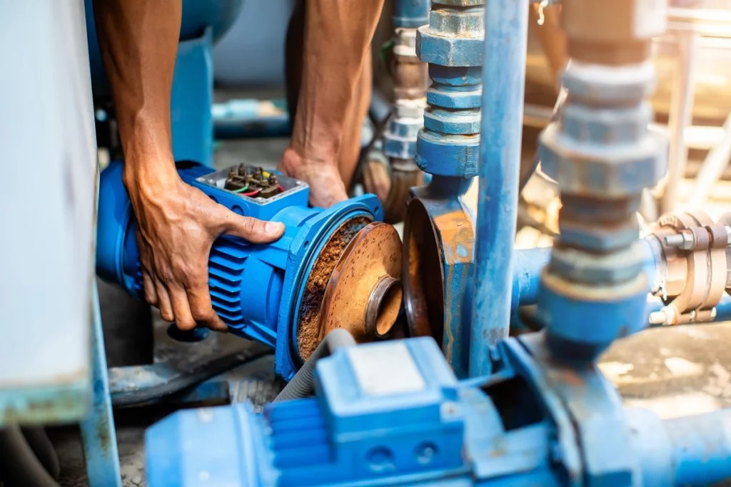 Pump spare parts and repair tools on a workbench
